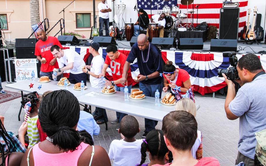What's Fourth of July without a hot dog eating contest? Six servicemembers get 10 minutes to eat six hot dogs  at the ''Freedom Rocks'' celebration, put on by Morale, Welfare and Recreation at Naval Support Activity Bahrain, Thursday.