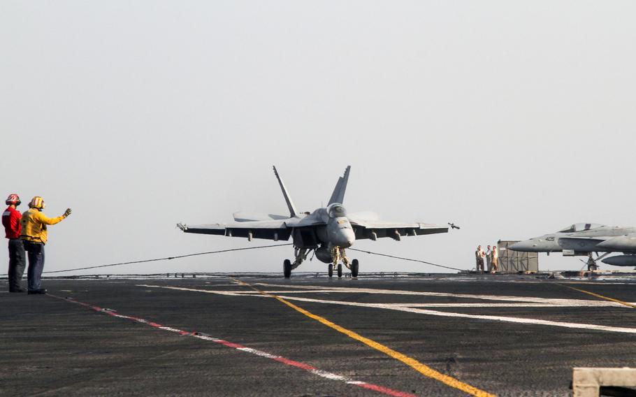 An F/A 18 Super Hornet lands on the deck of the USS George H.W. Bush, which is underway in the Persian Gulf, Aug. 10, 2014. F/A 18s are among launched from the Bush are among aircraft  conducting air strikes in Iraq.
