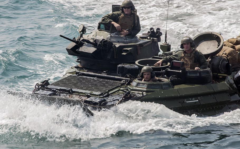 Marines aboard an amphibious assault vehicle approach the well deck of the USS Bataan, the flagship for the Bataan Amphibious Ready Group, on Aug. 24, 2014. The Navy announced Friday, Oct. 3, 2014, that the Bataan Ready Group had left the U.S. Navy's 5th Fleet area of responsibility and was on its way back to the United States.