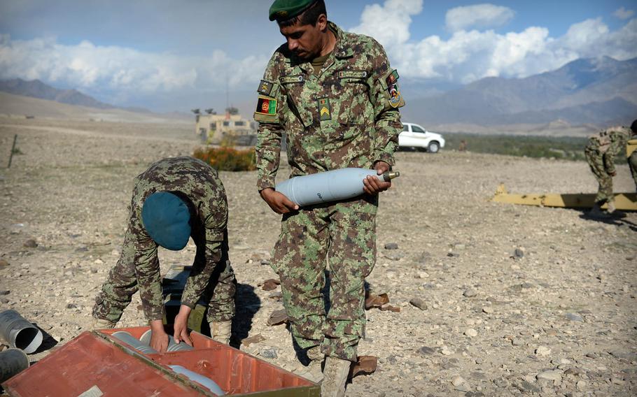 Afghan National Army soldiers prepare to load a 122mm howitzer during a clearing operation in Laghman province, Nov. 4, 2014. Security forces said they killed or wounded as many as 6 insurgents during the 1-day operation.

