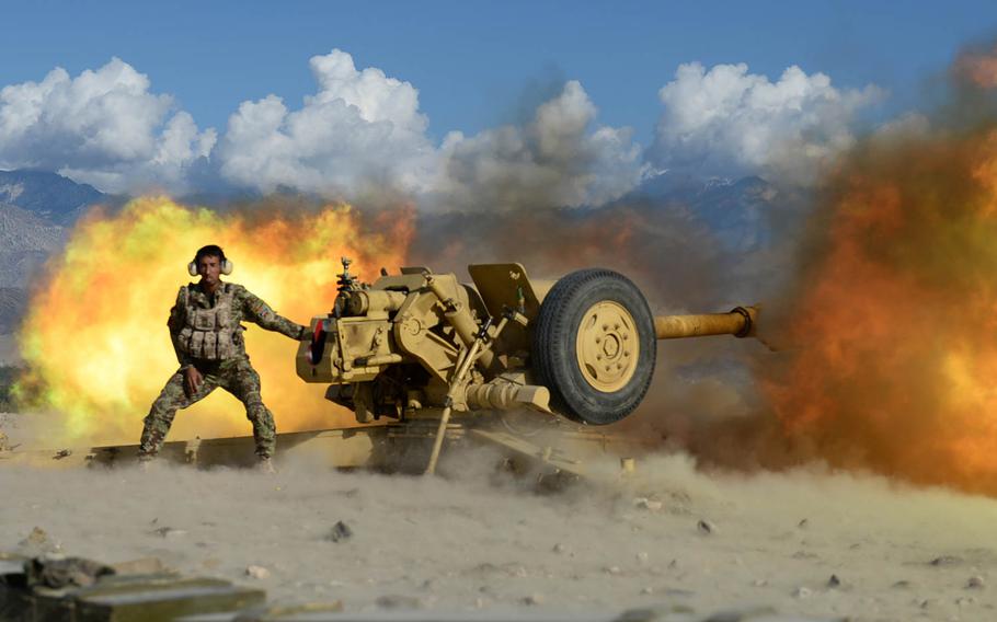 An Afghan National Army soldier fires a 122mm howitzer at Taliban positions during a clearing operation in Laghman province, Nov. 4, 2014. Security forces are struggling to make decisive gains in an insurgency that shows no signs of fading. 

