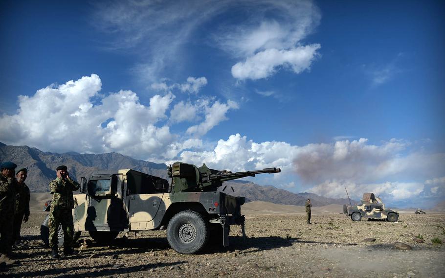 Afghan National Army soldiers fire a 23mm cannon at Taliban positions during a clearing operation in Laghman province, Nov. 4, 2014. Security officials say insurgents can't face off against government forces in head-on engagements, but they often return after the troops have left.

