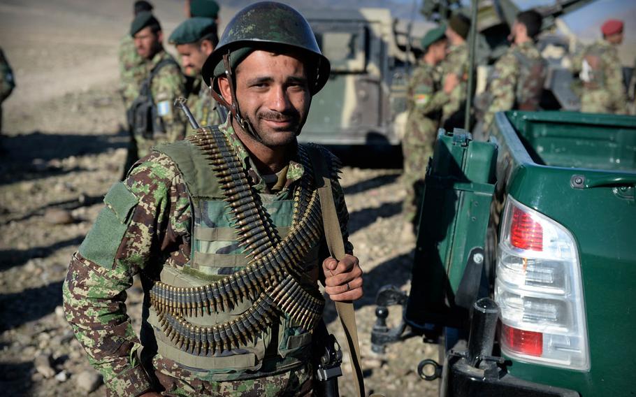 An Afghan National Army soldier walks to a truck after a clearing operation in Laghman province Nov. 4, 2014. Officials in the province say insurgents rarely stand and fight the army but often survive to return and plant bombs or pressure local residents.

