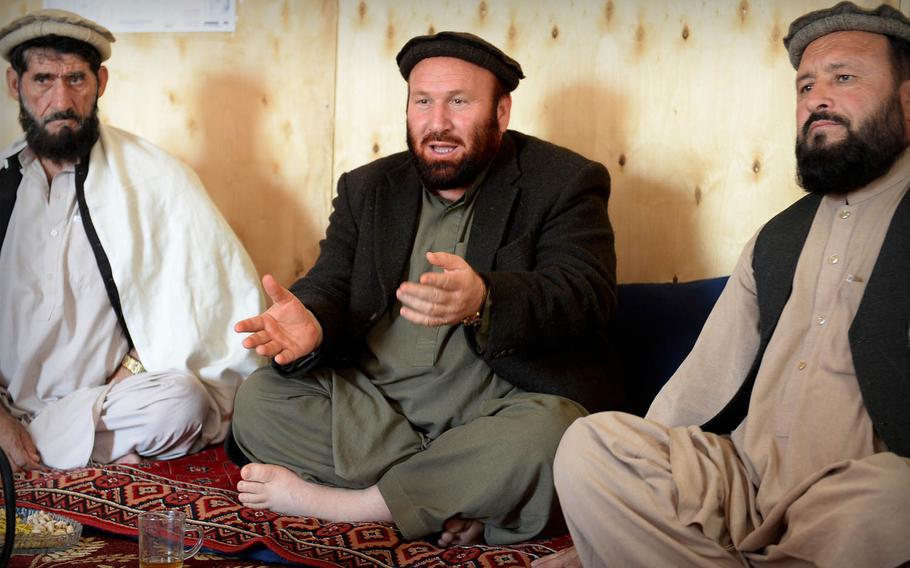 Afghan Local Police commander Haji Noorani, center, speaks to other police and tribal leaders in Laghman province Nov. 5, 2014. He offered a sober assessment of the situation in his province: 'The politicians say all is well, but it is not true.'

