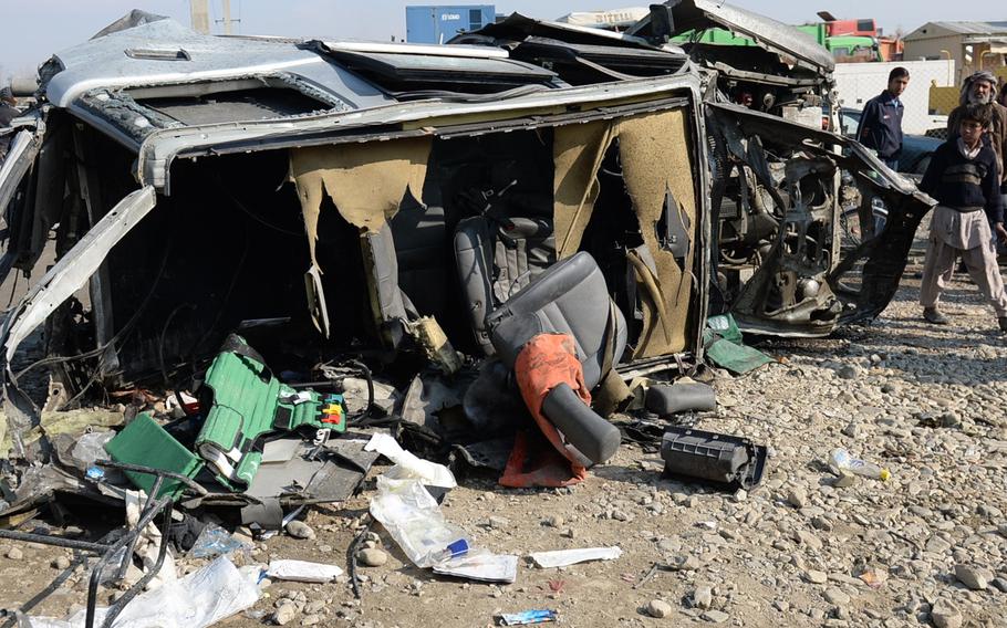 The remnants of a British Embassy vehicle, destroyed by a massive Taliban car bomb, sit on the side of a road in eastern Kabul on Thursday, Nov. 27 2014.