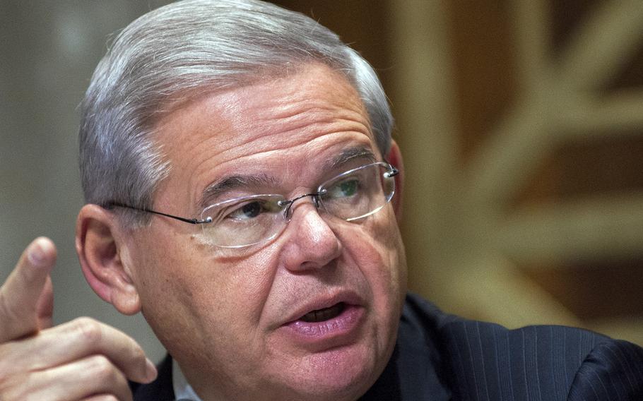 Sen. Robert Menendez, D-N.J., Chairman of the U.S. Senate Committee on Foreign Relations, discusses a proposal to authorize the limited use of U.S. armed forces against the Islamic State militant group during a session on Capitol Hill in Washington on Thursday Dec. 11, 2014.