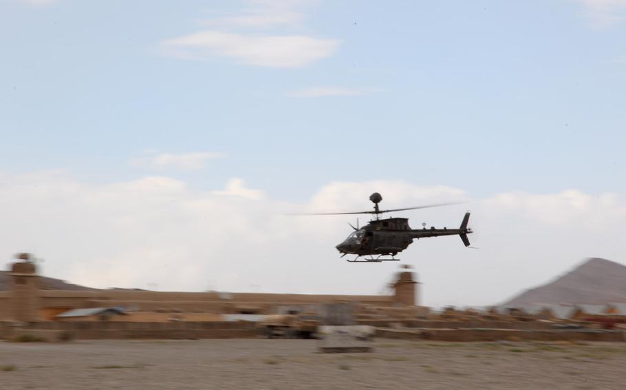 A OH-58 Kiowa Warrior helicopter takes off from the airfield on Forward Operating Base Gardez, Paktia province, Afghanistan, on Aug. 24, 2012. Two U.S. soldiers stationed at the base have been convicted on federal charges of bribery and fraud in connection with a scheme to sell fuel on the black market.