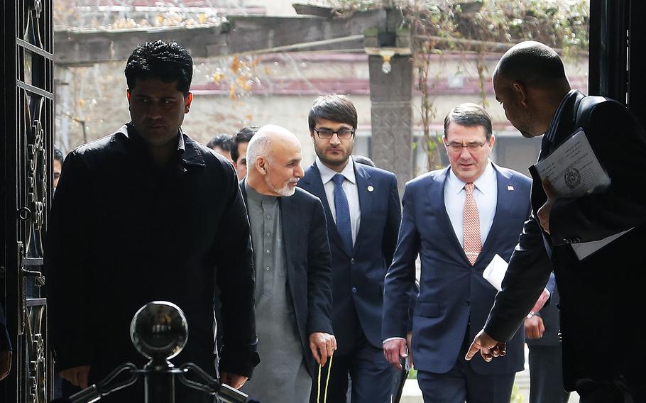 U.S. Defense Secretary Ash Carter and Afghan President Ashraf Ghani arrive at the Presidential Palace in Kabul, Afghanistan, on Saturday, Feb. 21, 2015. 