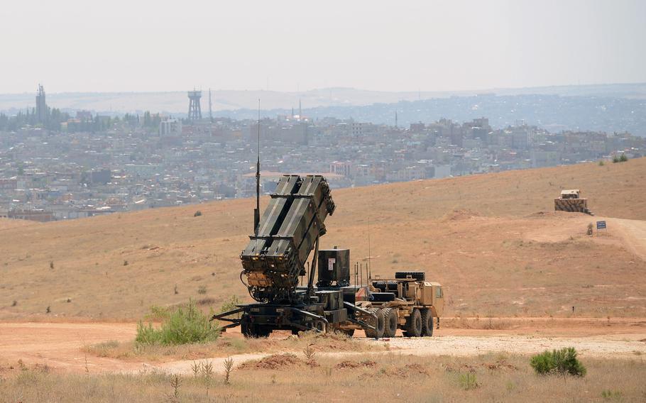 A Patriot missile launcher from the 3rd Battalion, 2nd Air Defense Artillery, overlooks Gaziantep, Turkey, and in the distance, Syria, in August 2013. Syrian opposition fighters will begin military training in May in Turkey. Fighting the Islamic State is a "priority," a Turkish official said, but the opposition force will also fight Syrian President Bashar al-Assad's  military. 
