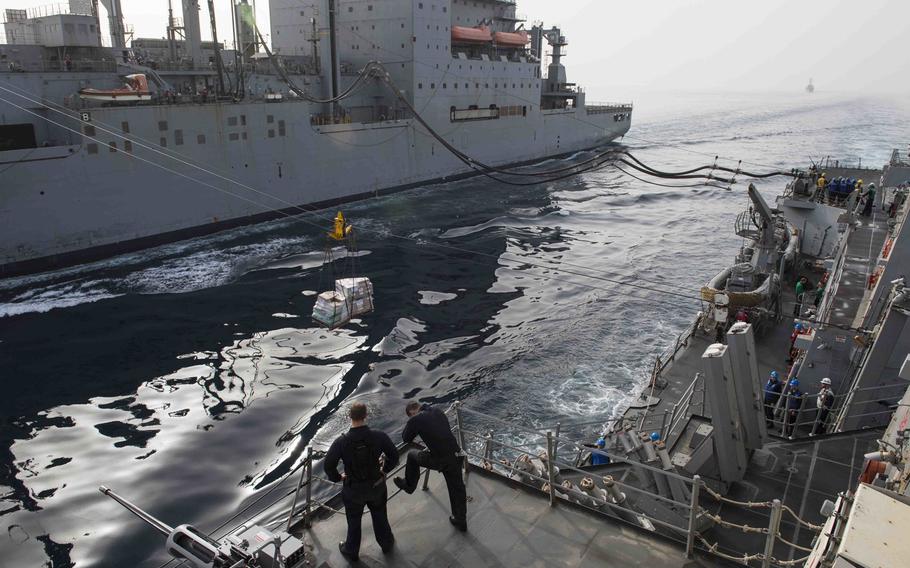 The guided-missile destroyer USS Farragut takes on fuel and supplies during a replenishment April 24, 2015. U.S. Navy Central Command dispatched the destroyer to the Strait of Hormuz after the Iranian navy seized a Marshall Islands-flagged cargo ship April 28, 2015.