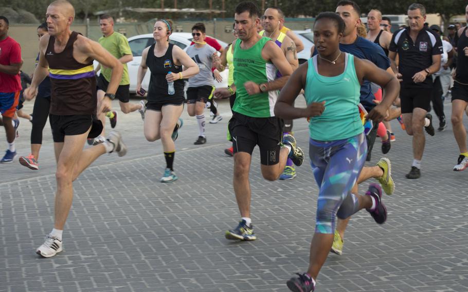 Runners begin the first lap of Naval Support Activity Bahrain's Pride Month three-kilometer race June 17, 2015.

