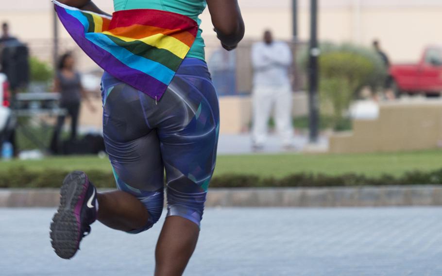 Marine Sgt. Doris Simmons runs toward the finish line of Naval Support Activity Bahrain's Pride Month three-kilometer race June 17, 2015, in support of the lesbian, gay, bisexual, and transgender community.  


