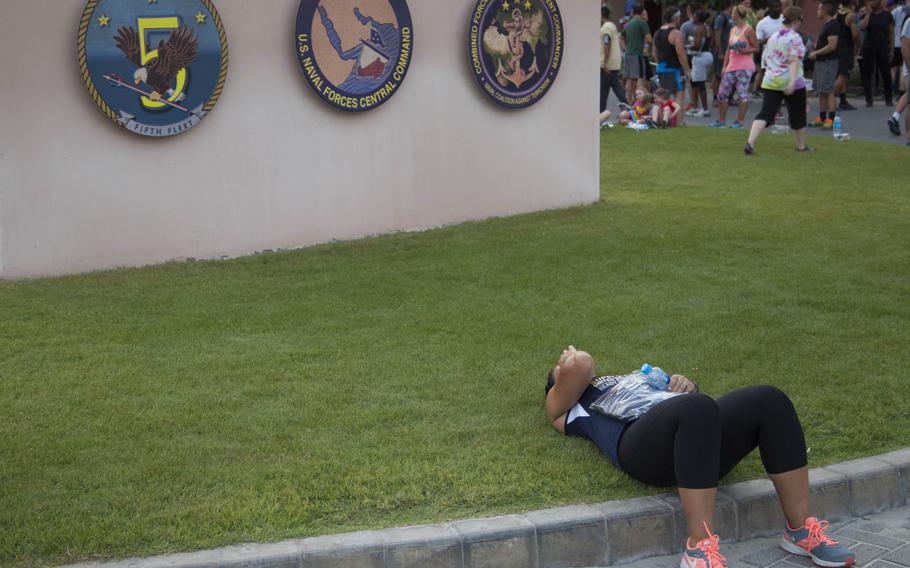 Lt. Analee Jacques rests following three-kilometer Pride Month race at Naval Support Activity Bahrain on June 17, 2015.


