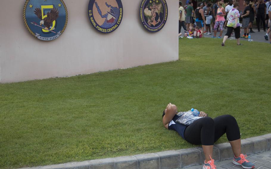 Lt. Analee Jacques rests following three-kilometer Pride Month race at Naval Support Activity Bahrain on June 17, 2015.


