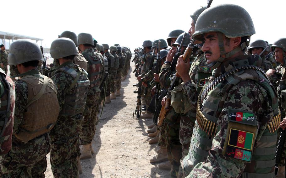 Afghan National Army soldiers with 2nd Kandak, 1st Brigade, 207th Corps stand in a mass formation on Forward Operating Base Delaram I, Nimroz province, Afghanistan June 16, 2012.