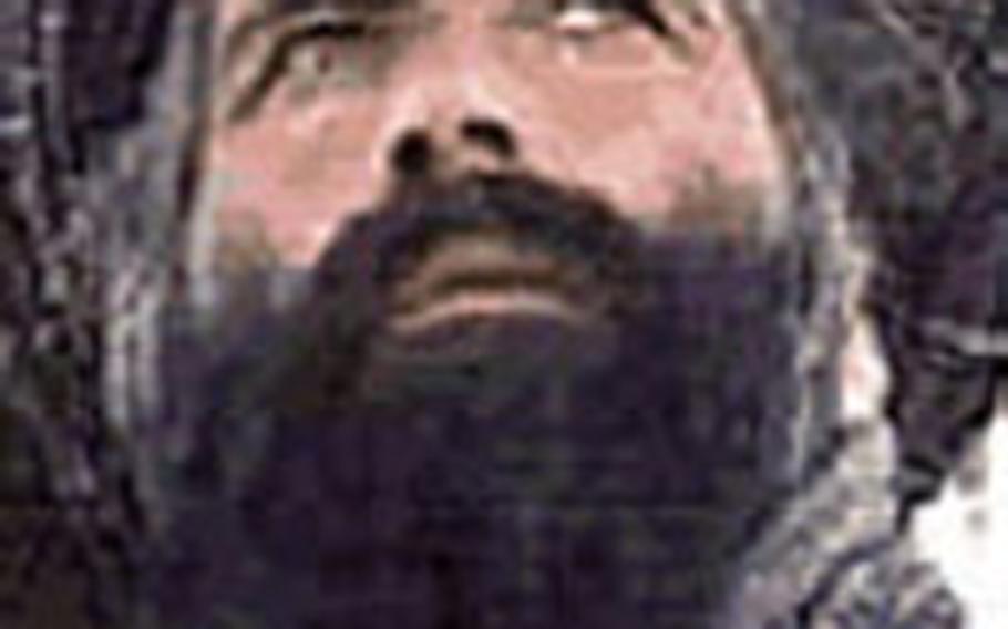 In this undated image released by the FBI, Mullah Omar is seen in a wanted poster.