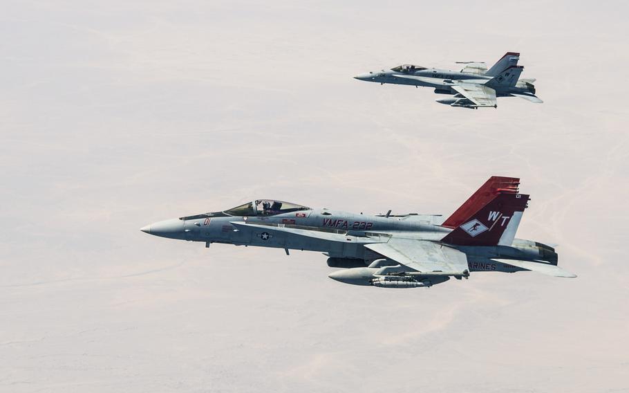 U.S. Marine Corps F/A-18s with Marine Fighter Attack Squadron 232 link up and perform an Air to Air refuel with a Royal Canadian Air Force CC-150 Polaris air-to-air refueller during a combat mission in the skies of Iraq on July 19, 2015.