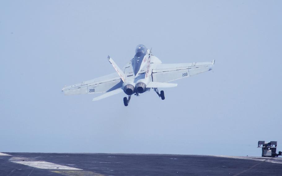 An F/A-18F Super Hornet launches from the flight deck aboard the aircraft carrier USS Theodore Roosevelt on Sept. 17, 2015, as part of Operation Inherent Resolve.