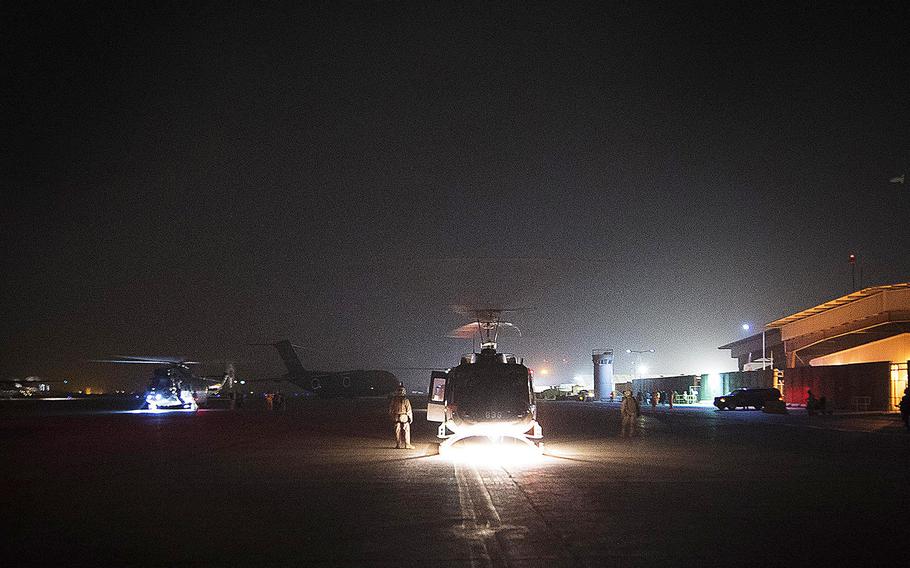 U.S. aircraft are seen parked at the airport in Baghdad on Tuesday Oct. 20, 2015. 