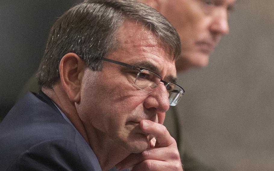 Secretary of Defense Ash Carter listens to comments during a Senate Committee on Armed Services hearing on Capitol Hill in Washington, D.C., on Tuesday, Oct. 27, 2015. During the hearing, Carter said raids like the one in Iraq involving U.S. troops likely will be a part of the U.S. strategy in the region.