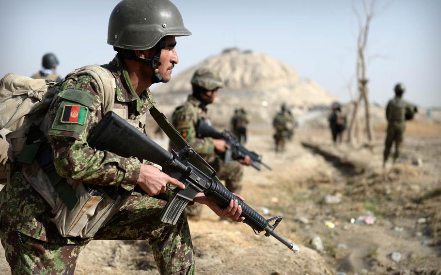 Afghan National Army soldiers provide security during a patrol in Kandahar province in January 2015. Taliban forces attacked a base near Kandahar Air Field on Tuesday, Dec. 8, 2015.