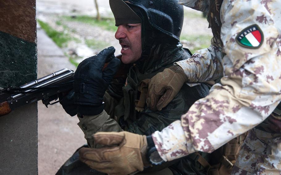 An Italian trainer provides one-on-one instruction to a Peshmerga fighter during a break from contact drill near Irbil, Iraq, Jan. 6, 2016. Coalition trainers in Northern Iraq have trained more than 6,000 Peshmerga soldiers in basic and advanced infantry skills.