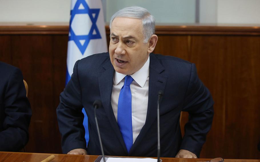 Israeli Prime Minister Benjamin Netanyahu opens the weekly cabinet meeting at his Jerusalem office on Sunday,  Feb. 7, 2016. 