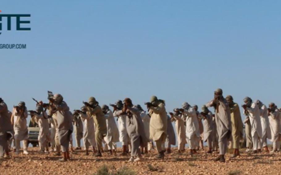 This image posted online Feb. 5, 2016, by supporters of the Tripoli Province of the Islamic State in Libya on a social media site, shows fighters training at a camp in Libya. American warplanes struck multiple targets in Libya overnight, hitting what was apparently an Islamic State training camp and a senior extremist leader, a U.S. official said Friday, Feb. 19, 2016.