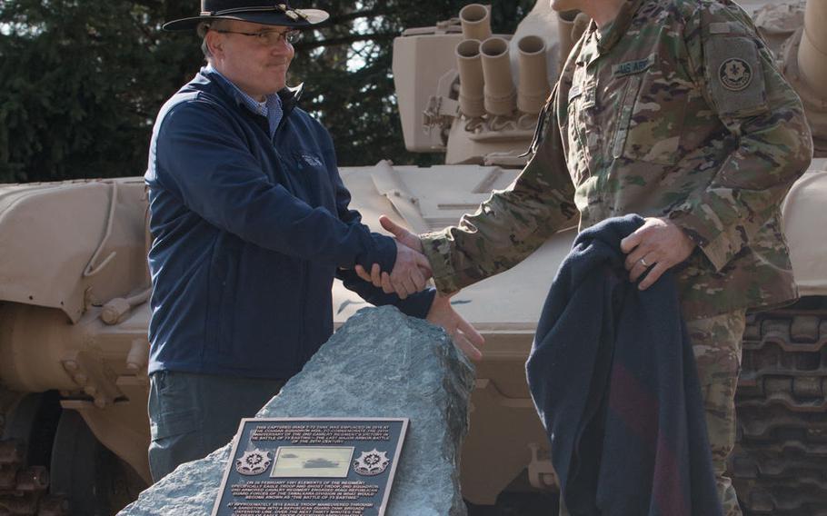 U.S. Army Lt. Col. Steven Gventer, right, and retired Lt. Col. Timothy Gauthier unveil a monument dedicated to the Battle of 73 Easting, on March 10, 2016, in Vilseck, Germany. This battle, in which Gauthier took part, was a decisive victory for the Army during the Gulf War. 


