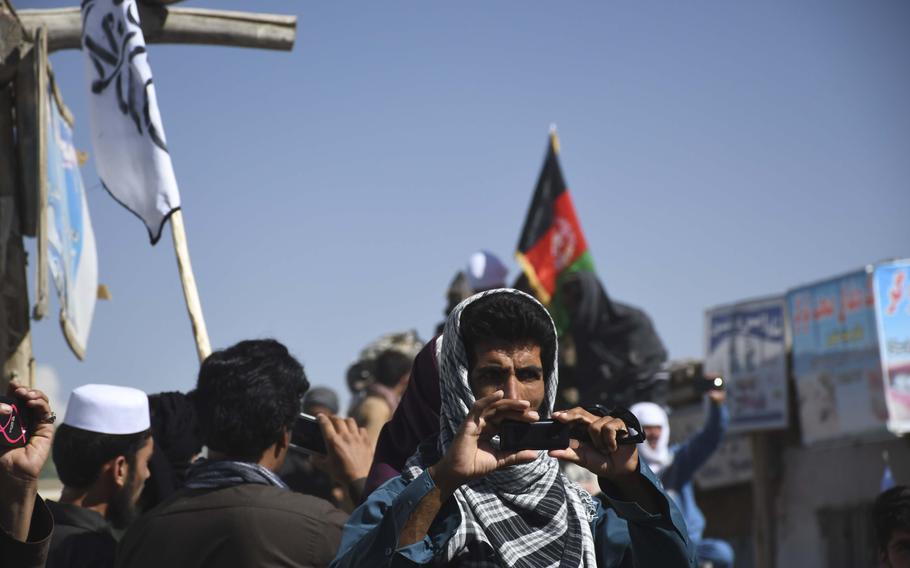 Residents of a Taliban district took selfies with both Taliban and Afghan flags in Logar province, Afghanistan, over the weekend. 
