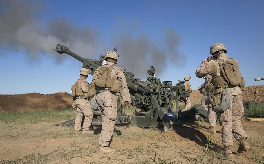 U.S. Marines fire an M777A2 Howitzer at an an Islamic State infiltration route on March 18, 2016, on Fire Base Bell, Iraq. The Pentagon announced Wednesday, April 6, 2016, that the U.S. military is considering opening up more small outposts in Iraq.