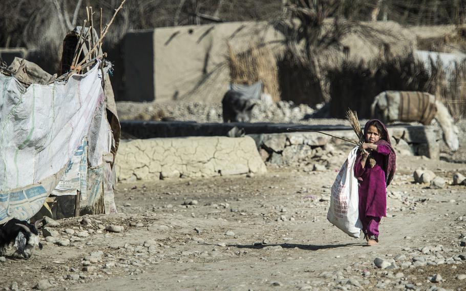 Refugees escaping the fighting of Islamic State and the Taliban occupy a place known as "tent city" outside of Camp Fenty, Afghanistan, Feb. 18, 2016.