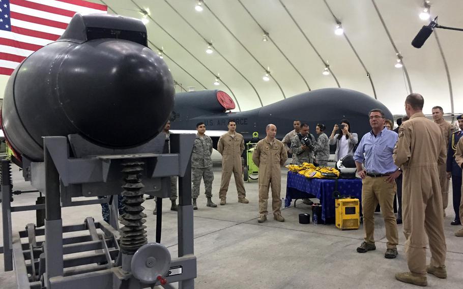 Secretary of Defense Ash Carter talks to airmen from the 99th Air Expeditionary Squadron at Al Dhafra Air Base Saturday, April 16, 2016. 