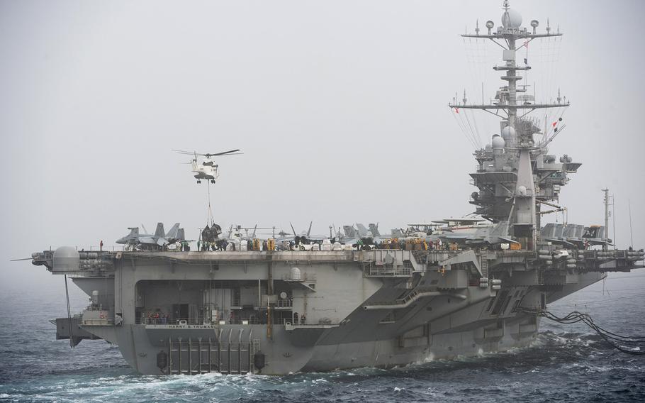 In this March 16, 2016 file photo, the nuclear-powered aircraft carrier USS Harry S. Truman receives cargo while deployed in the Arabian Gulf. The Truman and its accompanying strike group left Norfolk, Va. November 16, 2015 received word their deployment would be extended an additional 30 days Saturday. 