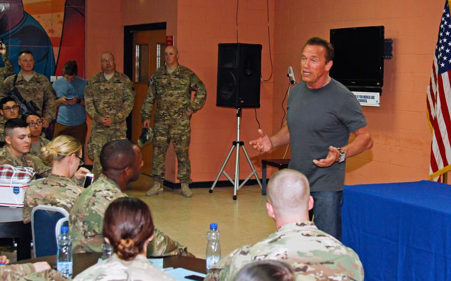 Arnold Schwarzenegger, former governor of California, speaks with soldiers stationed at Camp Arifjan, Kuwait, about green energy, Thursday, April 28, 2016. Schwarzenegger was in Kuwait to film a National Geographic documentary, "Years of Living Dangerously," focused on climate change. 


