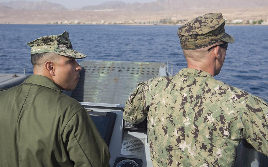 Chief Quartermaster Jaime Villalopoos, left, and Chief Machinist Mate Billy Nesbit guide Landing Craft, Utility 1635 from well deck of the dock landing ship USS Harpers Ferry to the Jordanian coast in support of Exercise Eager Lion 16 on May 9, 2016.