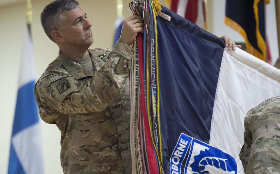 Lt. Gen. Stephen J. Townsend uncases the XVIII Airborne Corps colors during the transfer-of-authority ceremony of Combined Joint Task Force Operation Inherent Resolve, held at an undisclosed location in Southwest Asia, Aug. 21, 2016.  Lt. Gen. Townsend and XVIII Airborne Corps took authority of the task force from Lt. Gen. Sean B. MacFarland and III Corps.  The task force was created to defeat the Islamic State group in Iraq and Syria.