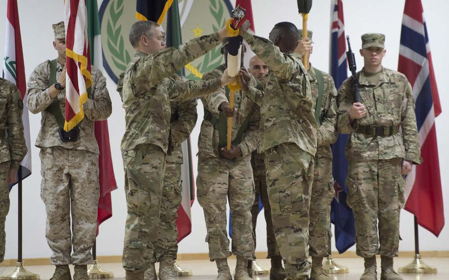 Lt. Gen. Sean B. MacFarland helps case III Corps' colors during the transfer-of-authority ceremony of the Combined Joint Task Force Operation Inherent Resolve, held at an undisclosed location in Southwest Asia, Aug. 21, 2016.  Lt. Gen. Stephen J. Townsend and XVIII Airborne Corps took authority of task force from MacFarland and III Corps.  The task force was created to defeat the Islamic State group in Iraq and Syria.