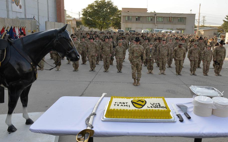 Soldiers, most with the Army's 1st Cavalry Division and wearing the unit's traditional Stetson and spurs, stand in formation before a ceremony celebrating the division's 95th birthday with a cake-cutting and presentation of the division's distinctive combat patch on Tuesday, Sept. 13, 2016.

