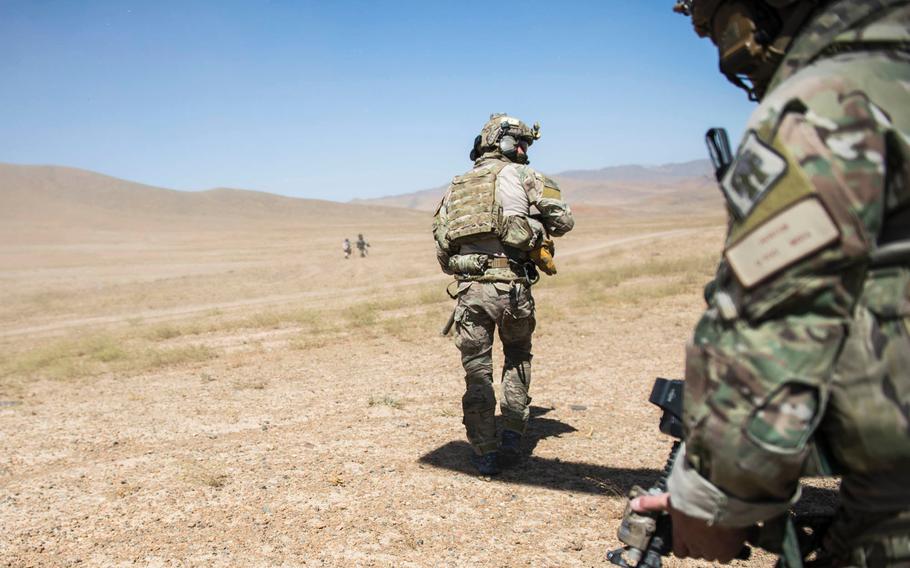 Pararescuemen assigned to the 83rd Expeditionary Rescue Squadron, approach a downed Afghan Air Force pilot during a training mission near Kabul, Afghanistan, Sept. 6, 2016. A foreign servicemember was killed in an apparent insider attack in the Afghan capital on Wednesday, Oct. 19, 2016, the Defense Ministry said.