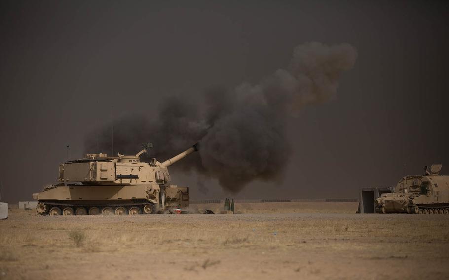 A U.S. Army M109A6 Paladin conducts a fire mission at Qayyarah West, Iraq, in support of the Iraqi security forces' push toward Mosul, Oct. 17, 2016. 