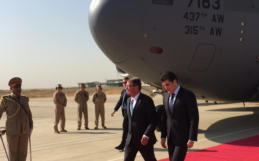 Secretary of Defense Ash Carter is greeted by Kurdistan Regional Government prime minister Nechervan Barzani as he arrives in Irbil, Iraq, Sunday. 