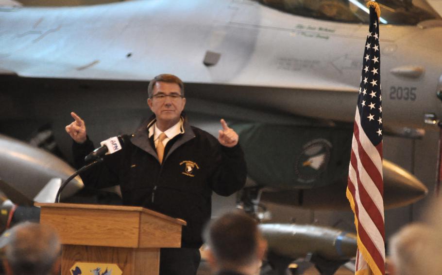 Secretary of Defense Ash Carter makes a point while addressing more than 300 airmen at Aviano Air Base, Italy, on Tuesday, Dec. 13, 2016. Aviano is Carter's latest stop on a globe-spanning tour a few months before he leaves office.