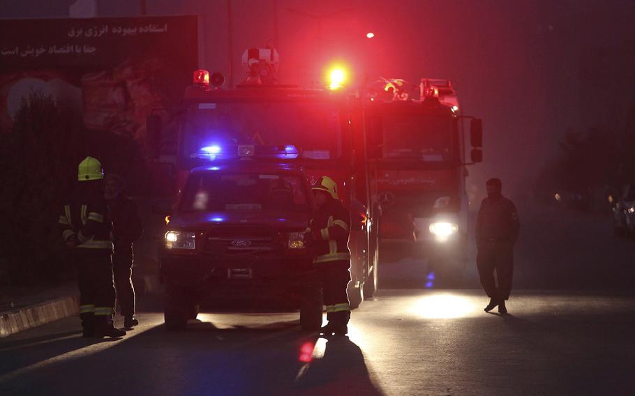 Afghan firefighters arrive near the site of two large bombings in Kabul, Afghanistan, Tuesday, Jan. 10, 2017.