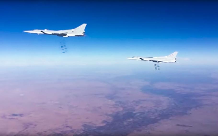 This photo provided by the Russian Defense Ministry Press Service shows Russian air force Tu-22M3 bombers strike Islamic State group targets in Syria on Tuesday, Jan. 24, 2017.