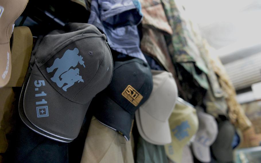 A row of hats marked with the 5.11 Tactical logo are on sale at an Irbil market on Friday, Dec. 23, 2016. Shops in Iraq are selling cheap counterfeits and knockoffs to Iraqi forces and civilians, some of whom say they buy the brand for its durability and suitability as battle gear.

