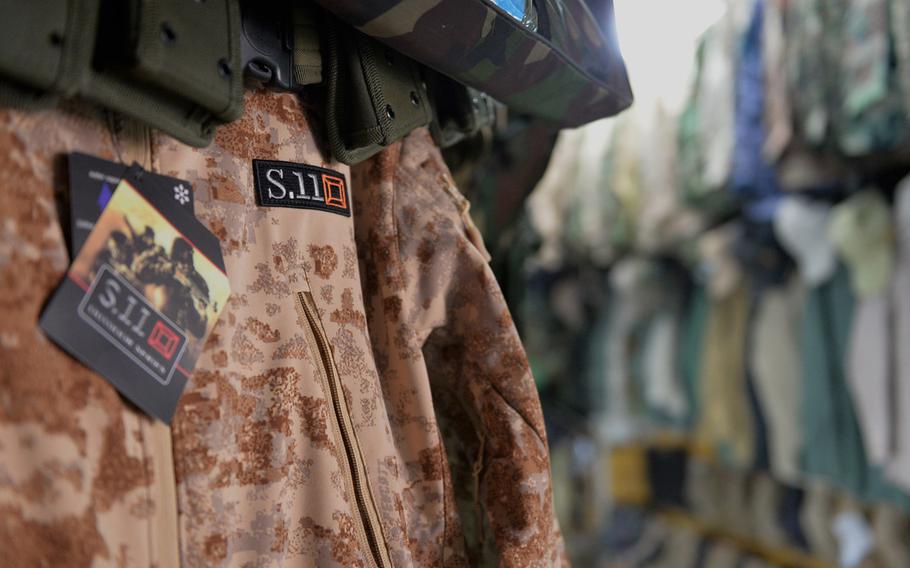 A camouflage jacket similar in style to one made by Irvine, Calif.-based 5.11 Tactical, but marked with the deceptively similar S.11 logo, hangs in a shop in Irbil, Iraq, Dec. 23, 2016.
