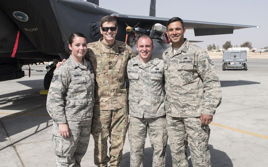 Staff Sgt. Alexandria Morrow, from left, 332nd Air Expeditionary Maintenance Squadron weapons load crew chief, Gen. Joseph L. Votel, U.S. Central Command commander, Senior Airman Lucas Marthaller, 332nd EMXS, and Staff Sgt. Carlos Olivarez, 332nd EMXS, on Feb. 23, 2017, in Southwest Asia. Morrow died from injuries sustained while performing work duties in support of Operation Inherent Resolve.