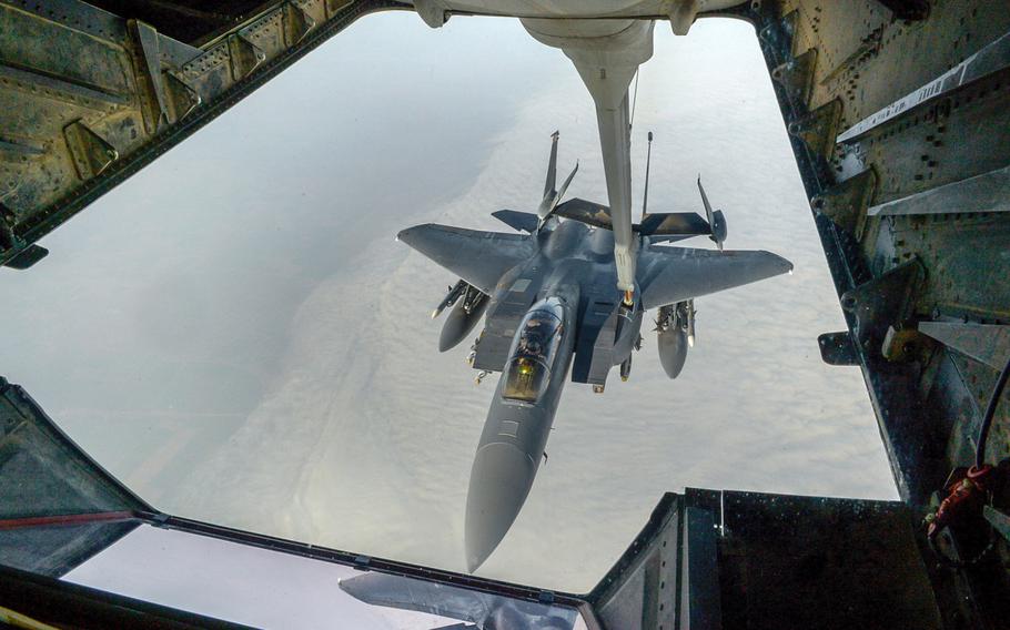 F-15E Strike Eagle refuels from a KC-10 Extender assigned to the 908th Expeditionary Air Refueling Squadron during a Combined Joint Task Force - Operation Inherent Resolve mission over an undisclosed area, on March 20, 2017. The U.S. military announced Thursday, April 13, that a misdirected airstrike on Tuesday killed 18 allied fighters battling the Islamic State group in northern Syria.