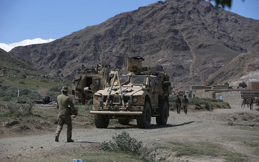 U.S. forces and Afghan commandos are seen in Asad Khil village near the site of a U.S. bombing in the Achin district of Jalalabad, east of Kabul, Afghanistan, Saturday, April 17, 2017.